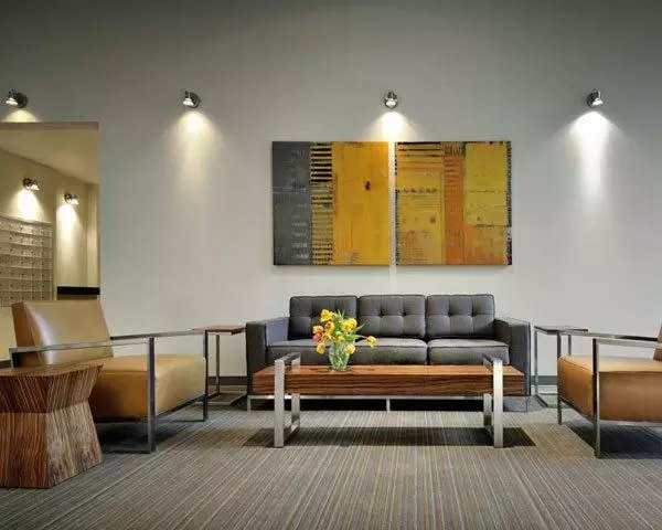 Clubhouse with modern furnishings and entertainment options at On the Park Apartments