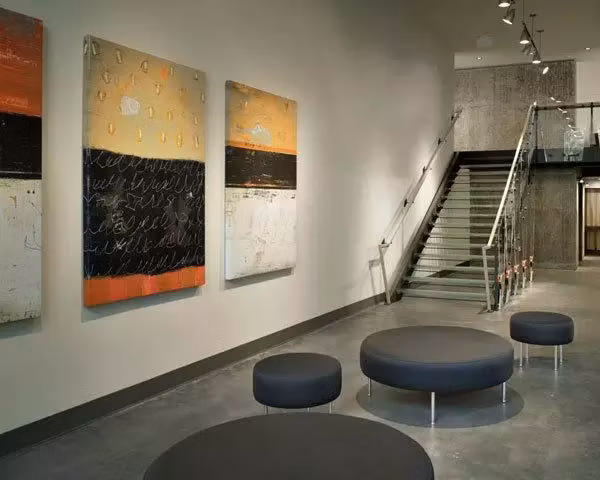 Clubhouse featuring modern decor and open seating at On the Park Apartments, perfect for social gatherings and community events