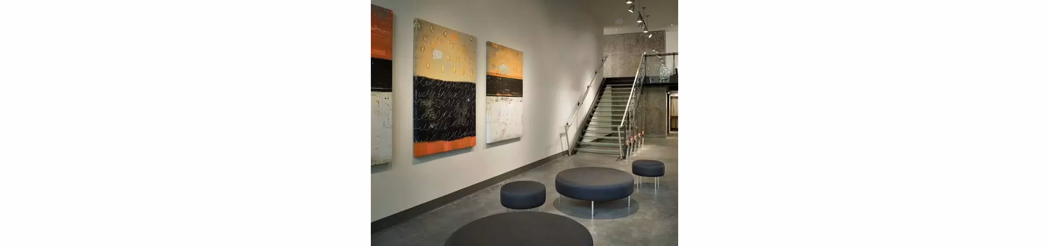Clubhouse featuring modern decor and open seating at On the Park Apartments, perfect for social gatherings and community events