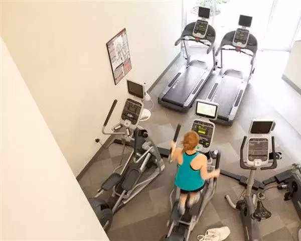Modern fitness center equipped with state-of-the-art machines at On the Park Apartments