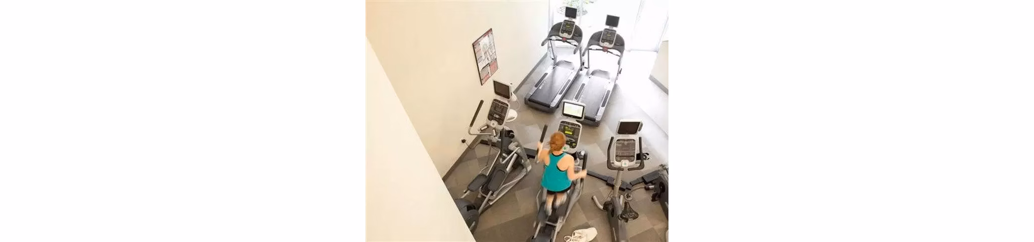 Modern fitness center equipped with state-of-the-art machines at On the Park Apartments