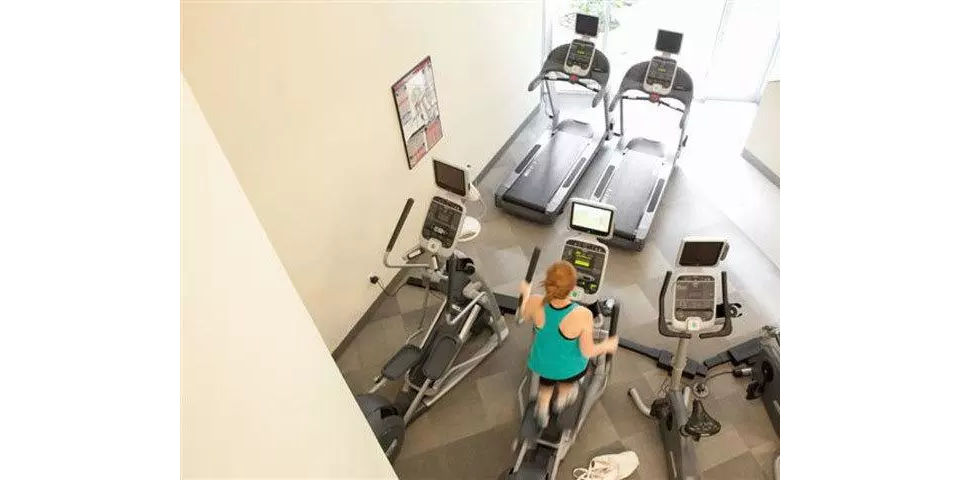 Modern fitness center equipped with state-of-the-art machines at On the Park Apartments