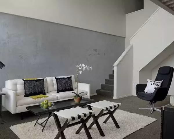 Spacious living room with modern decor at On the Park Apartments