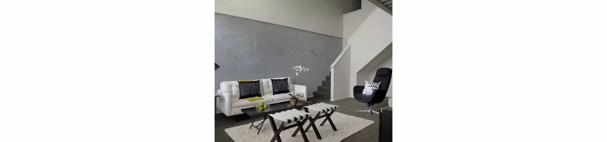 Spacious living room with modern decor at On the Park Apartments
