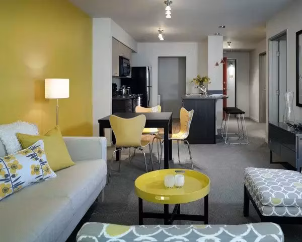 Bright living room with modern furnishings at On the Park Apartments, featuring luxury interiors and spacious design