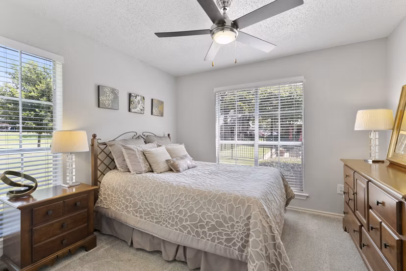 Cozy bedroom with modern decor at Creekwood Apartments