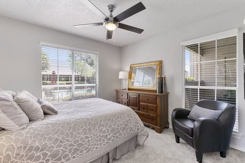 Cozy bedroom with elegant decor in Creekwood Apartments