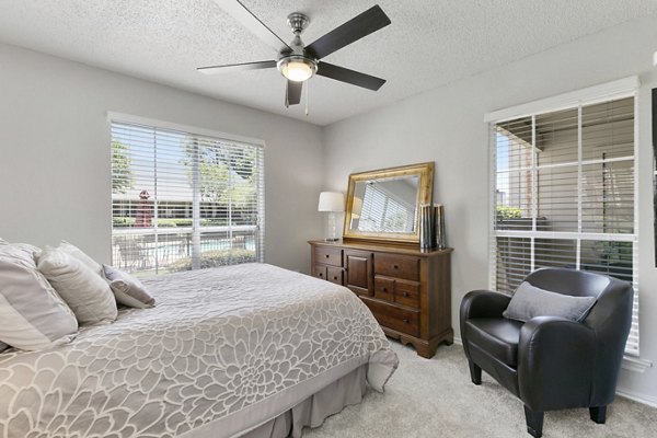Cozy bedroom with elegant decor in Creekwood Apartments