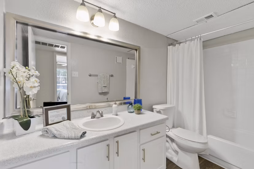 Modern bathroom with sleek fixtures at Creekwood Apartments