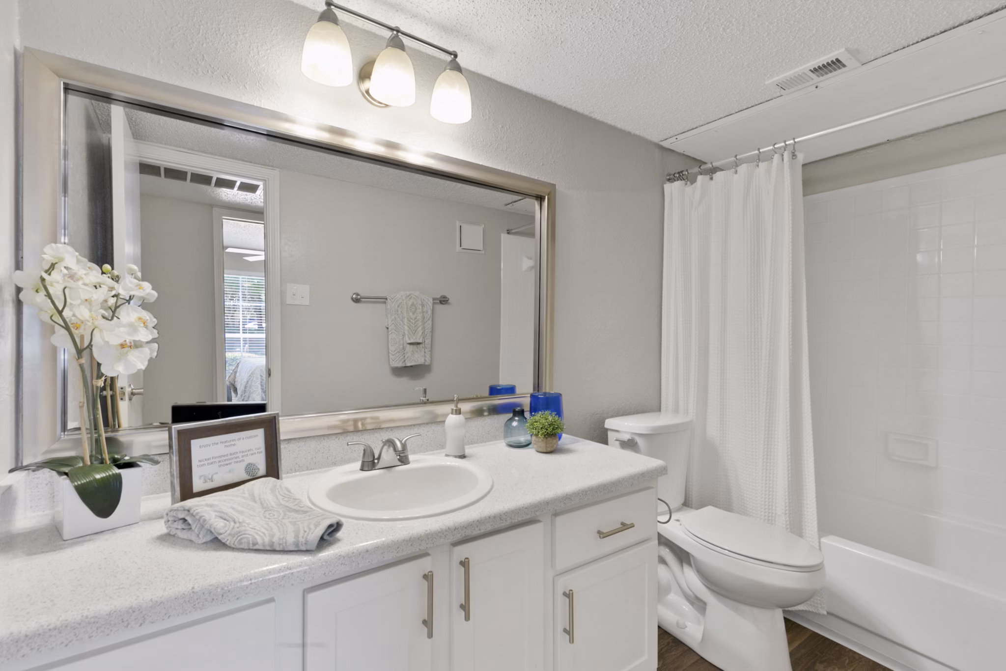 Modern bathroom with sleek fixtures at Creekwood Apartments
