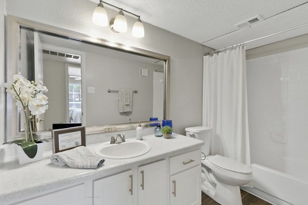 Modern bathroom with sleek fixtures at Creekwood Apartments