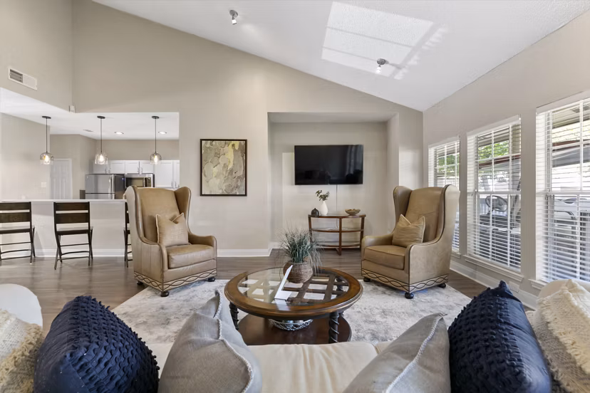 Clubhouse featuring modern design and leisure amenities at Creekwood Apartments