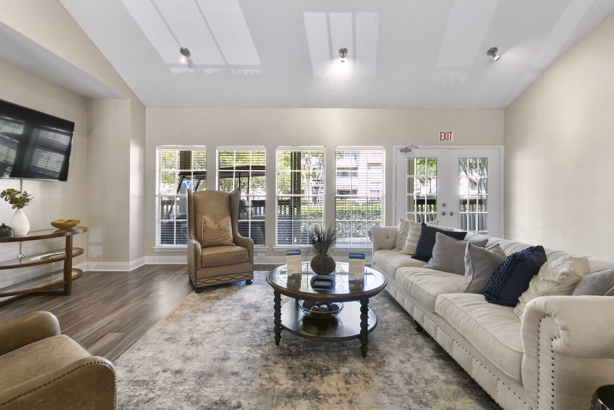 Clubhouse featuring modern design and cozy seating at Creekwood Apartments