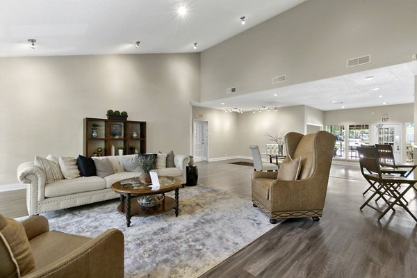 Clubhouse featuring modern decor and seating at Creekwood Apartments