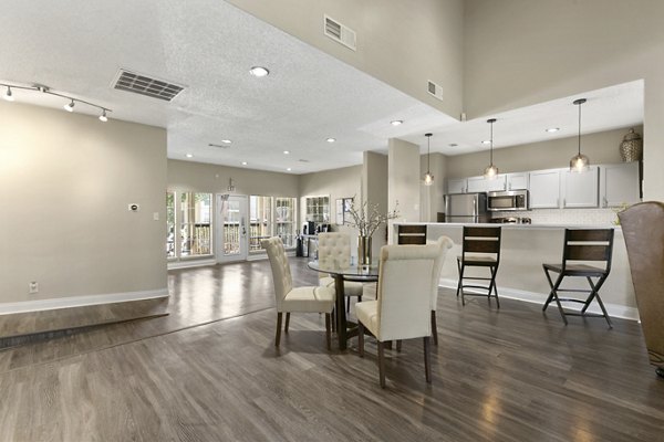 Clubhouse featuring modern design and cozy seating at Creekwood Apartments