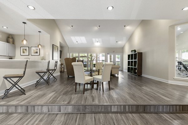 Creekwood Apartments: Elegant clubhouse with modern design and comfortable seating areas, perfect for community gatherings and events