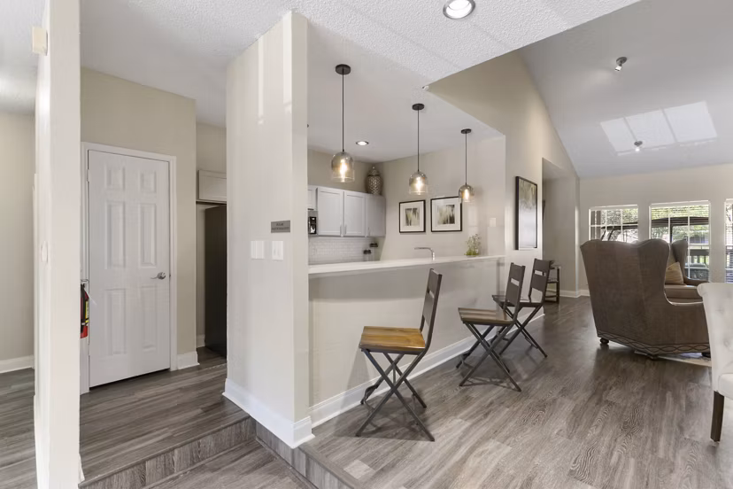 Modern clubhouse featuring a fireplace and lounge seating at Creekwood Apartments, creating a welcoming community space for residents