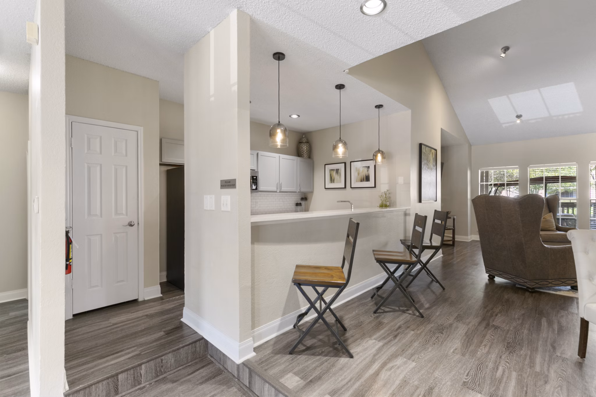 Modern clubhouse featuring a fireplace and lounge seating at Creekwood Apartments, creating a welcoming community space for residents