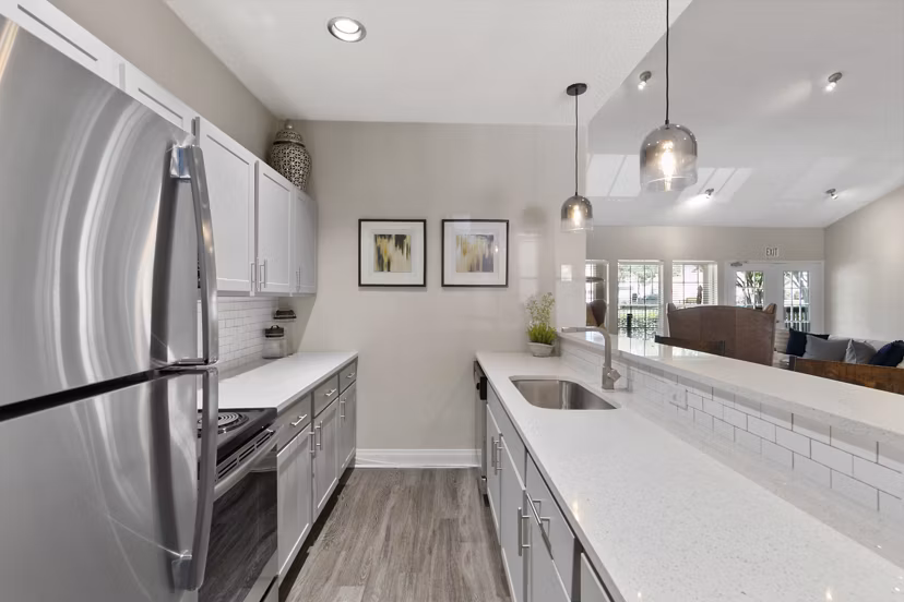 Clubhouse at Creekwood Apartments: Modern recreational space with lounge seating and billiards in Greystar's luxury community