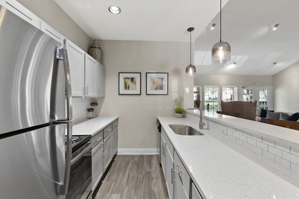 Clubhouse at Creekwood Apartments: Modern recreational space with lounge seating and billiards in Greystar's luxury community