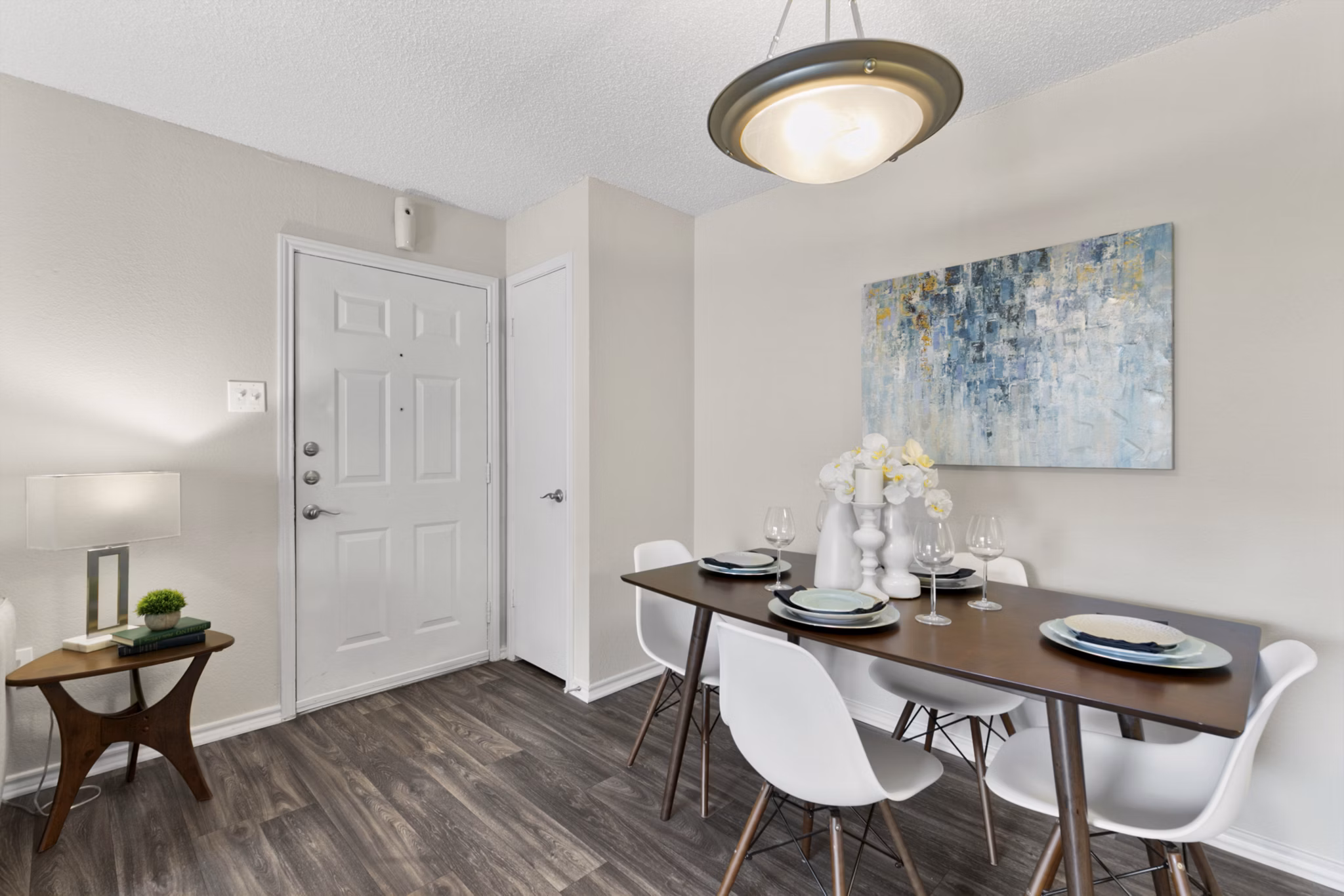 Dining area with modern furnishings in Creekwood Apartments, featuring stylish decor and ample natural light
