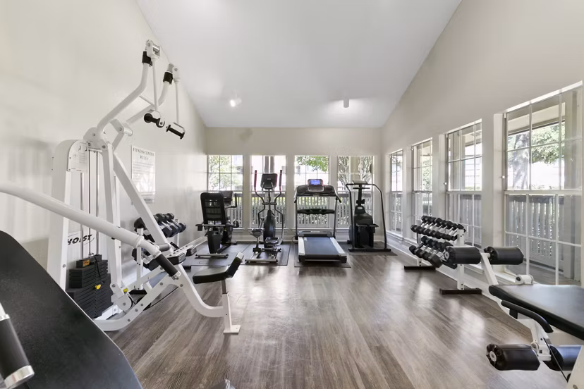 State-of-the-art fitness center with modern equipment in Creekwood Apartments