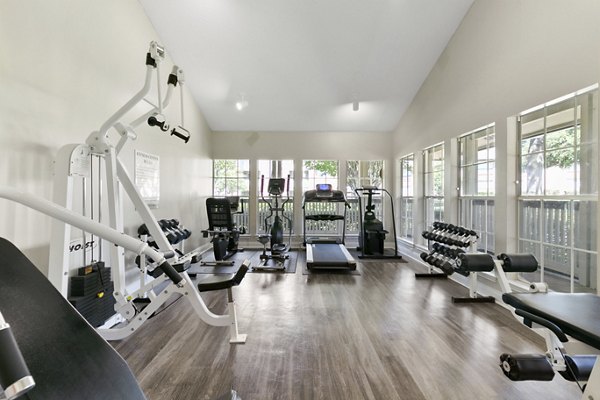 State-of-the-art fitness center with modern equipment in Creekwood Apartments