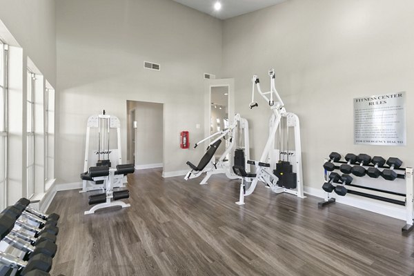 State-of-the-art fitness center with modern equipment at Creekwood Apartments offering luxury living and wellness amenities