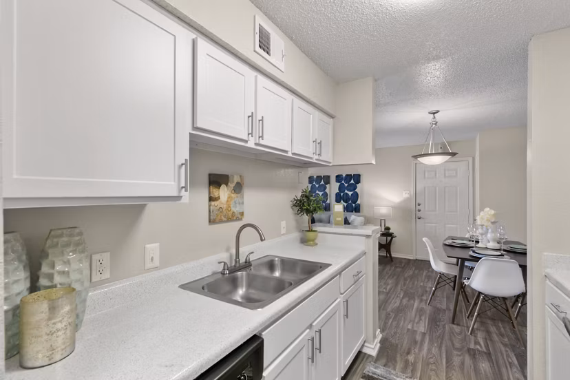 Sleek kitchen with modern appliances at Creekwood Apartments