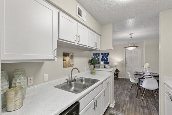 Sleek kitchen with modern appliances at Creekwood Apartments