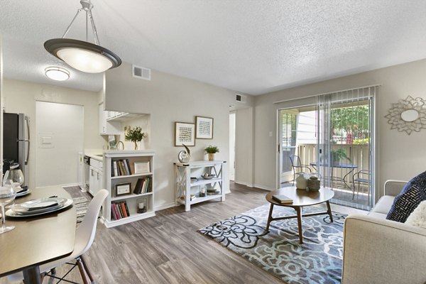 Spacious living room with modern decor at Creekwood Apartments