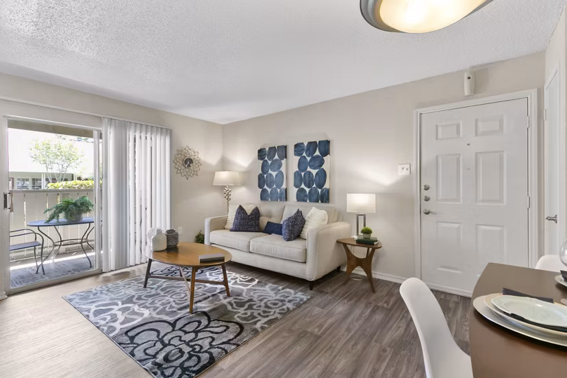Modern living room with stylish furnishings in Creekwood Apartments, offering comfort and luxury for residents