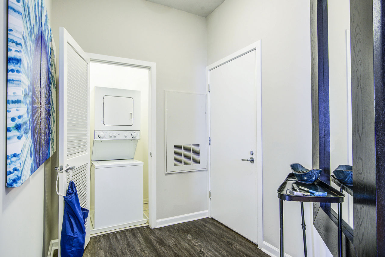 Laundry room at Aventine At Fort Totten A Greystar Avana Community