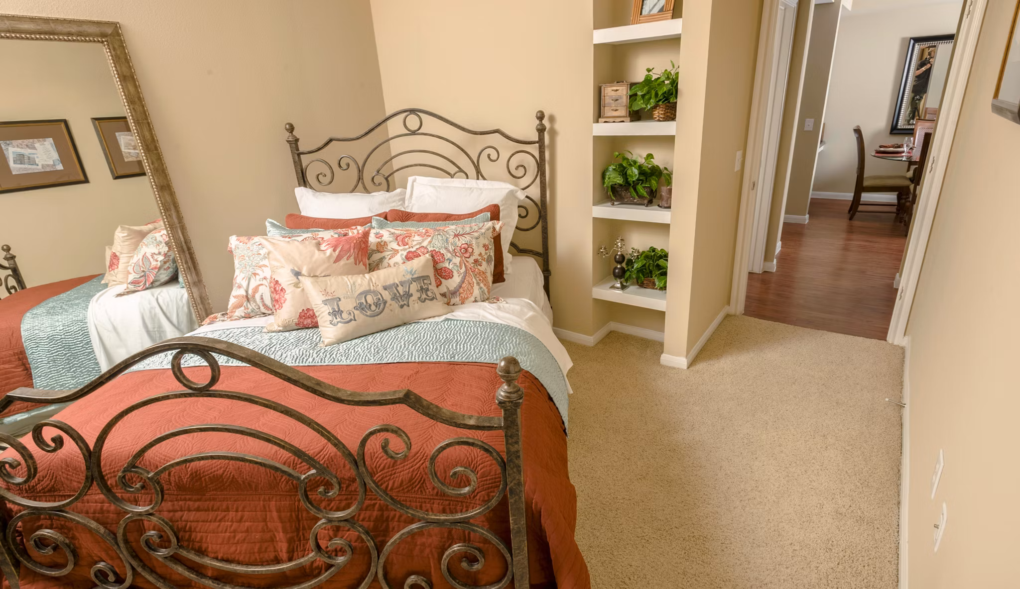 Modern bedroom with stylish decor at Broadwater Apartments, featuring luxurious bedding and ample natural light for a serene living experience