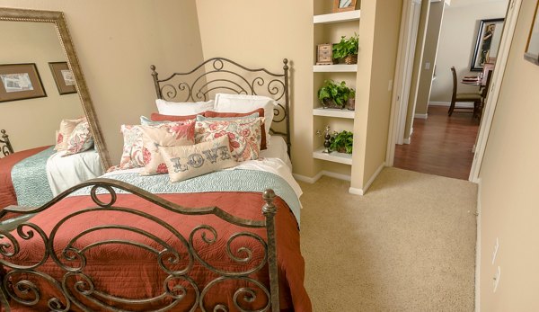 Modern bedroom with stylish decor at Broadwater Apartments, featuring luxurious bedding and ample natural light for a serene living experience