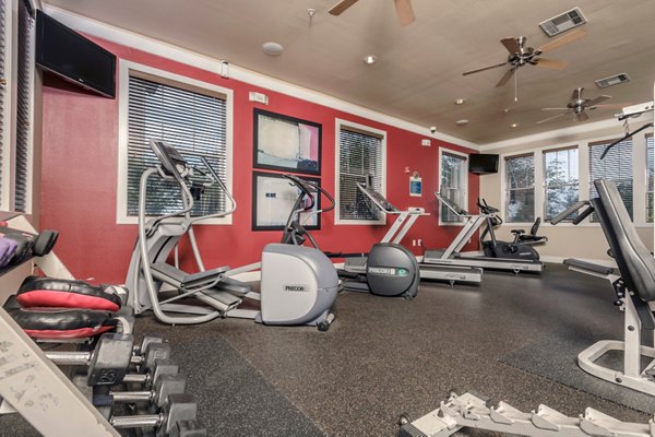 Fitness room with modern equipment at Broadwater Apartments offers residents a high-end workout experience