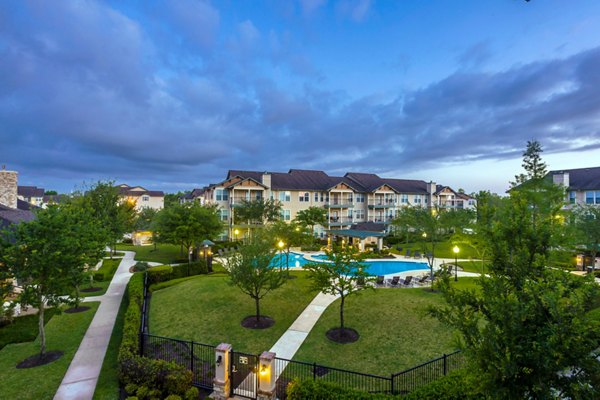 Olympic-sized pool with sleek lounge chairs at Broadwater Apartments, perfect for relaxation and swimming activities