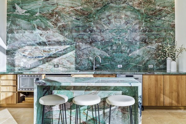 Clubhouse featuring modern lobby design at 44 Monroe Apartments with luxury seating and decor, offering a welcoming community atmosphere