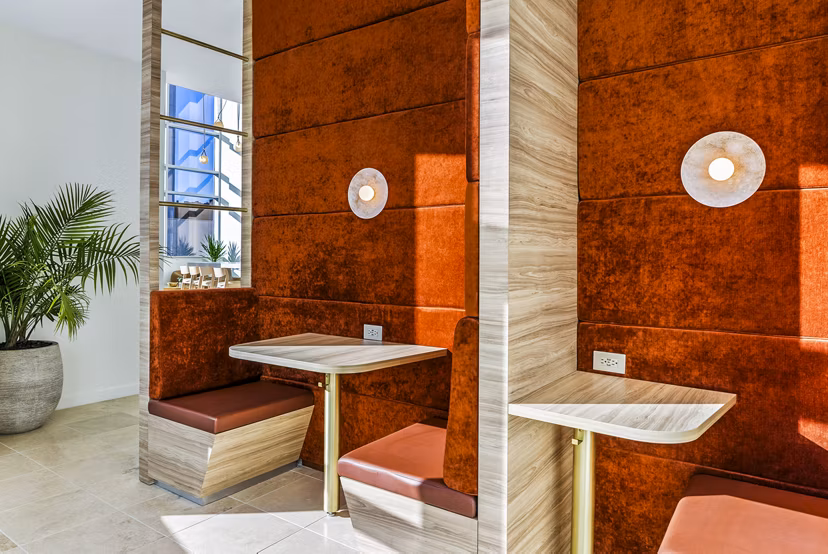 Clubhouse featuring modern decor and seating areas at 44 Monroe Apartments