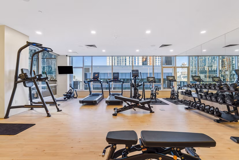Modern fitness center with state-of-the-art equipment at 44 Monroe Apartments offering convenient onsite exercise facilities