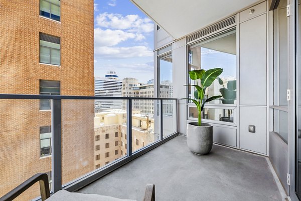 Patio with modern furniture and views at 44 Monroe Apartments