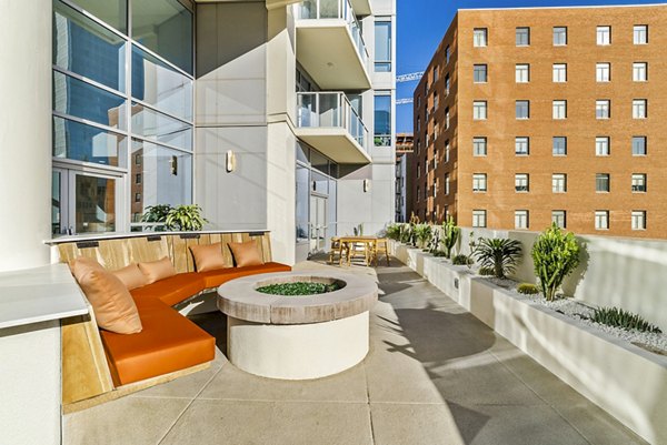 Beautiful patio with modern furnishings at 44 Monroe Apartments, offering stunning views and a relaxing outdoor space