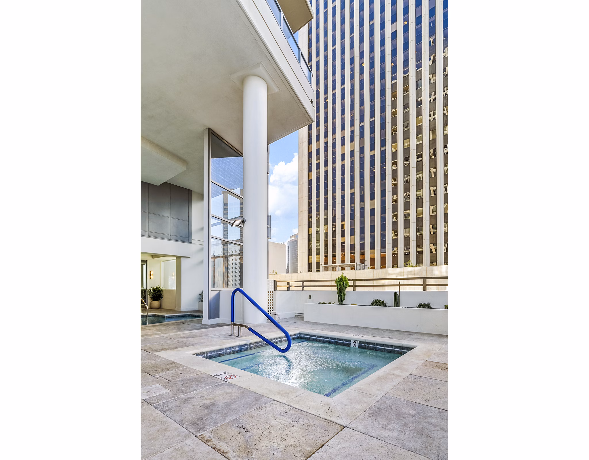 Relaxing jacuzzi on the rooftop at 44 Monroe Apartments, offering stunning city views and luxury amenities