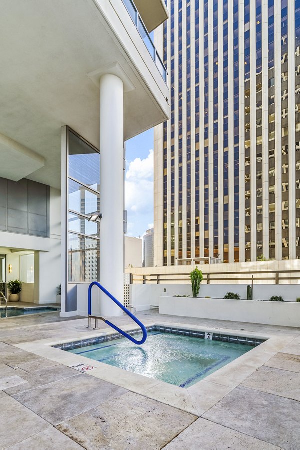 Relaxing jacuzzi on the rooftop at 44 Monroe Apartments, offering stunning city views and luxury amenities