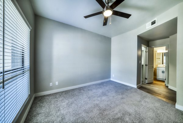 Elegant bedroom with modern furnishings in Hayden Park Apartments, luxury living by Greystar in a serene environment