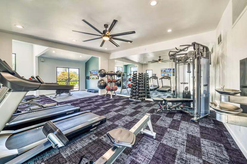 Fitness center with modern equipment at Hayden Park Apartments in Greystar community