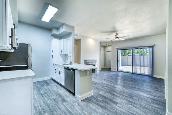 Modern kitchen with stainless steel appliances at Hayden Park Apartments