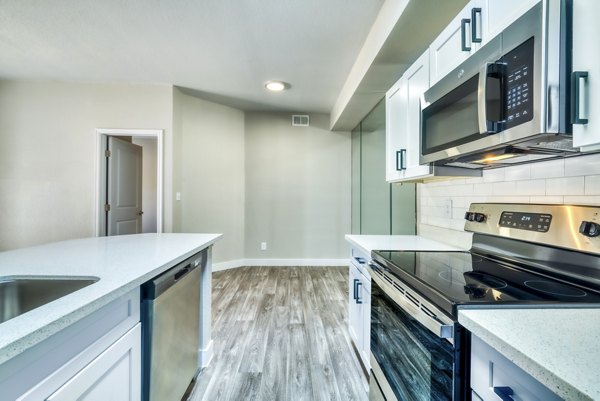 Modern kitchen with stainless steel appliances at Hayden Park Apartments