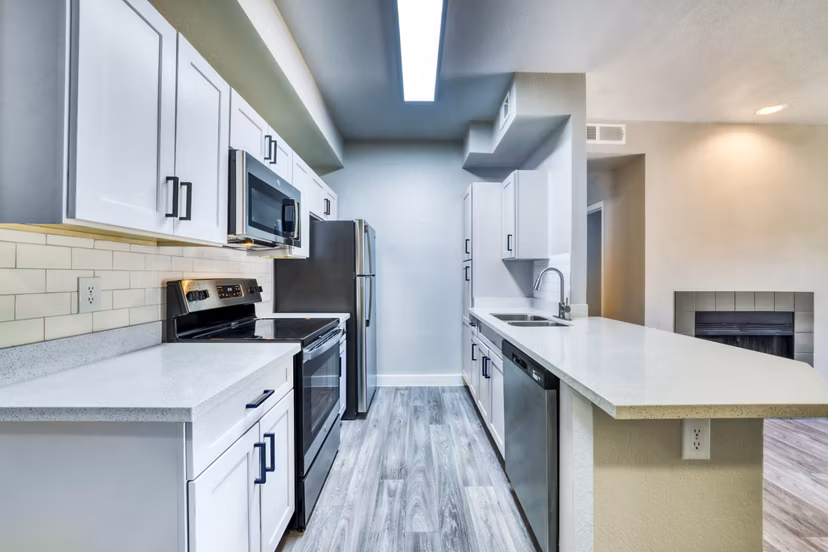 Modern kitchen with stainless steel appliances at Hayden Park Apartments