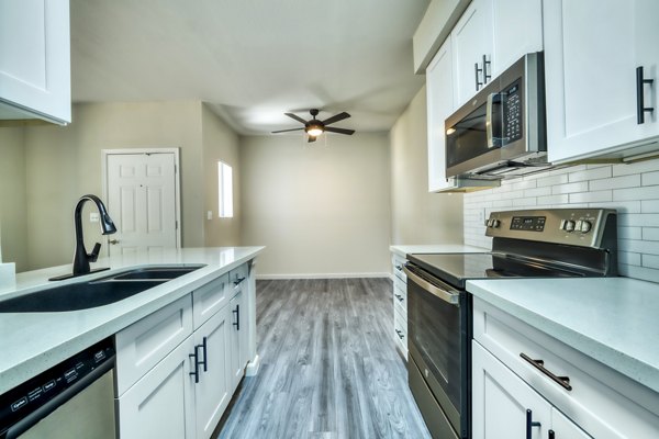 Spacious kitchen with modern appliances and granite countertops at Hayden Park Apartments